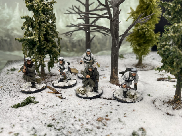 Squad 2 moves up through the woods