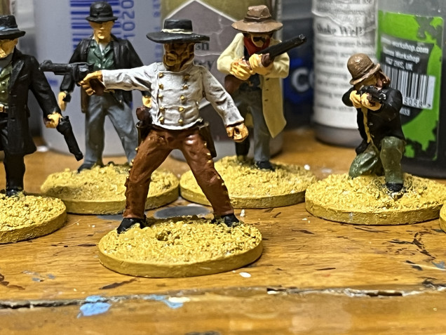 I painted up the beards on Charlie Prince and Ike Clanton and the bases for everybody. 
