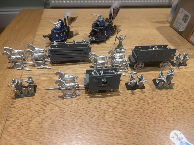 I don’t usually like resin, but I approve of resin for the wagon and metal for the cool details and horses. I still get the heft and sense of value I want from handling a miniature. Well done 1st corp.
