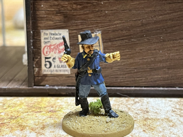 Flag bearer.  I’ll add the flag later.  This enlisted man is wearing an 1872 pattern coat with vertical pleats that might be hard to see here.  It was wildly unpopular and was discontinued in just a few years.  