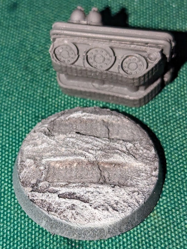 The base is spackle paste, which I pressed the vehicle down into before it dried twice, once in the centre, the other going straight back towards the base. Made excellent tracks, so I'll have to repeat the process with the other rovers, I think.