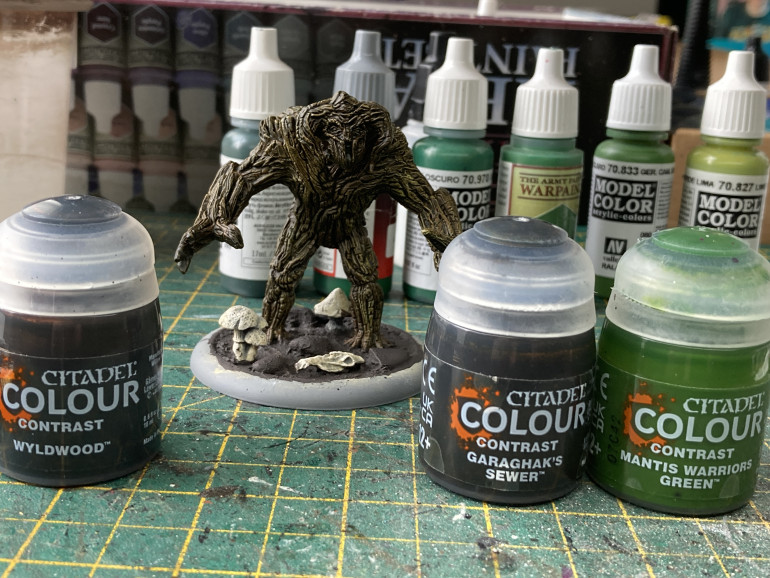 After the wyldwood I used dark sand to drybrush lighter spots on the treemen, but used it much more heavily on the treewoman as I was going to attempt to paint her as a birch tree.  I used a thinned down Garaghak's Sewer and Mantis Warriors Green to add interest on the two male treemen, varying the tone a bit.