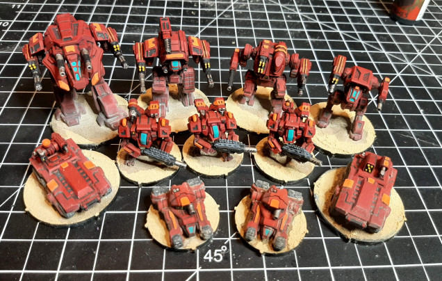 After glueing down I came back and put a strong tone wash under them to look like they are casting a shadow.  Then hit them up with pigment power to spread around the dust/sand look.