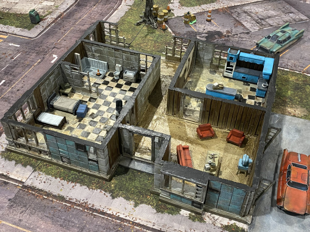 The roof of the main house is removable, and the tiles are just made from card.  The battlemats are also used for games of the walking dead.  The red car in the bottom right was printed on a cheap Ender 3 Filament printer and I am pretty happy with it came out.  