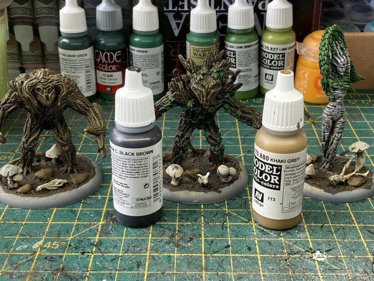 The bases were first painted with black brown then drybrushed with khaki grey. The two treemen were also given a drybrush with khaki grey to help bring out some of the texture.