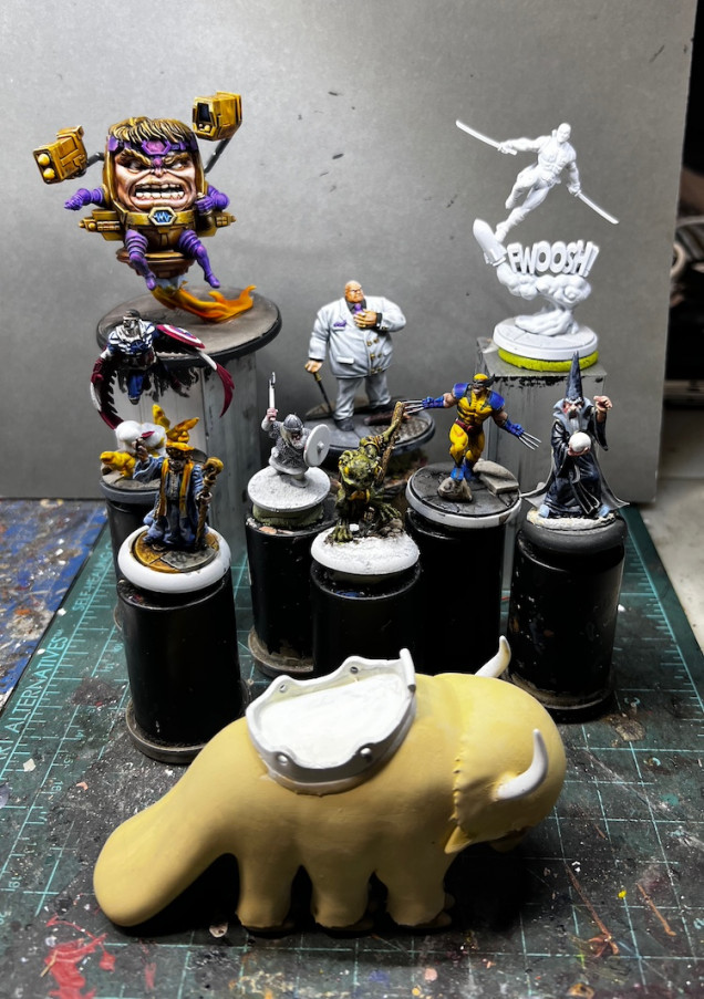 Quite the range of genre and states of completion sitting on my painting handles right now.  An Oathsworn Frog Wilding Warrior and MODOK are almost done while Deadpool is just primer.  I even have a resin printed Appa waiting for his next layers.