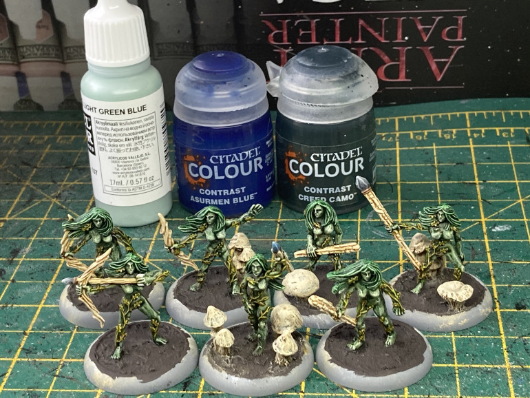I dotted the eyes with light green blue. I glazed the sorceress's staff with a thinned down Asurmen Blue Contrast (after painting it the usual grey colours as with my previous weapons). I then finally glazed the dryads skin with a thinned down Creed Camo Contast just to take the edge of the paleness of the highlights.