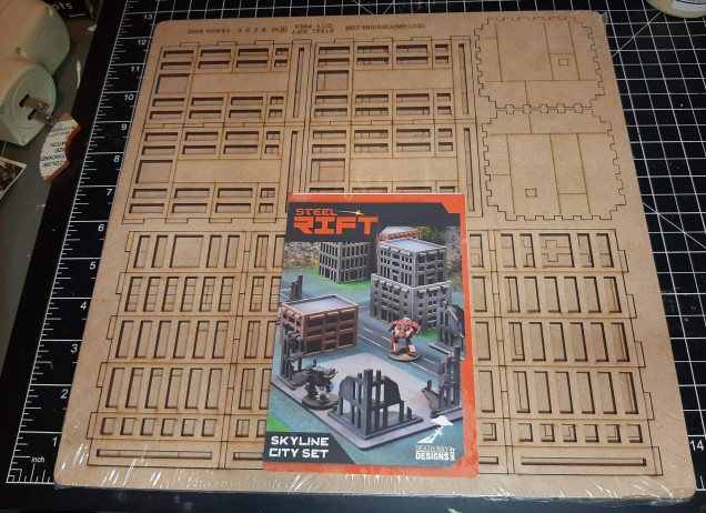 I don't have anything in terrain storage that would look right with a mech game so I had purchase the buildings set from Death Ray Designs.