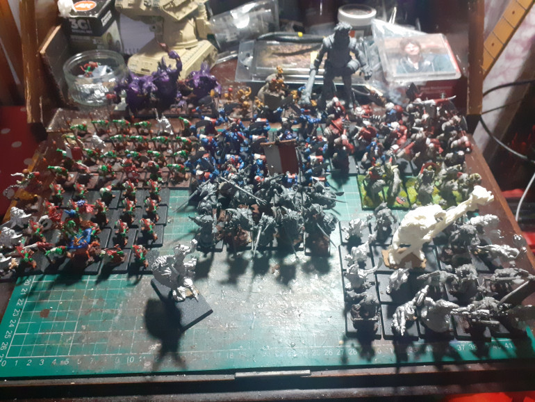 A menagerie of orcs and goblins In various stages of paint 
