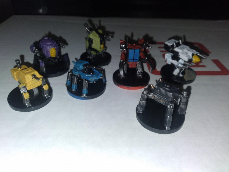 WIP on the mechs with the basic paint jobs done