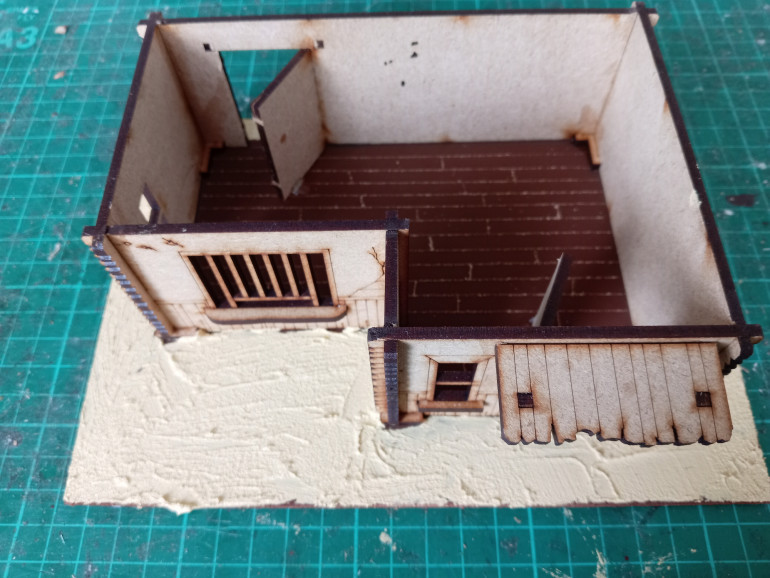 The first attempt - giving the Trading Post a floor and sandy exterior.