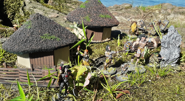 The minis and terrain from the Slaine: Kiss My Axe! Starter Set