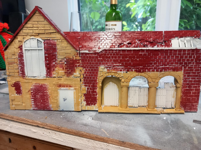 First coat and it looks so poppy. Lots of dry brushing required and the bricks need to be more orange.