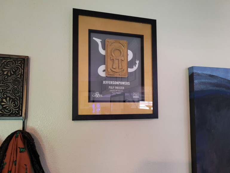 I had to move a few things around, but my community award has pride of place next to the coat rack by the front door.
