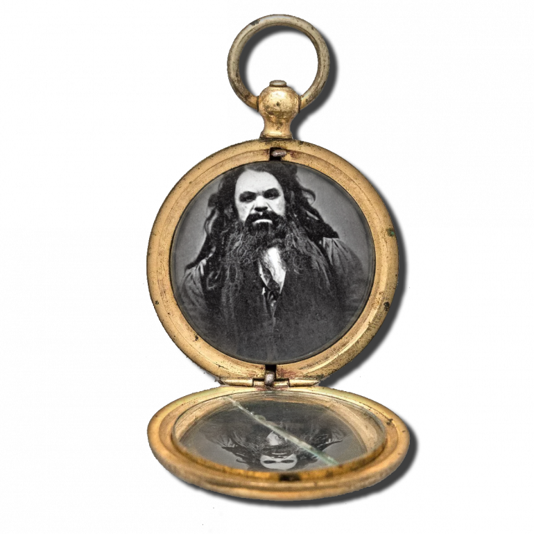 A woman's locket mirror with photo of a Dverge  man from Morgan Town,VW.