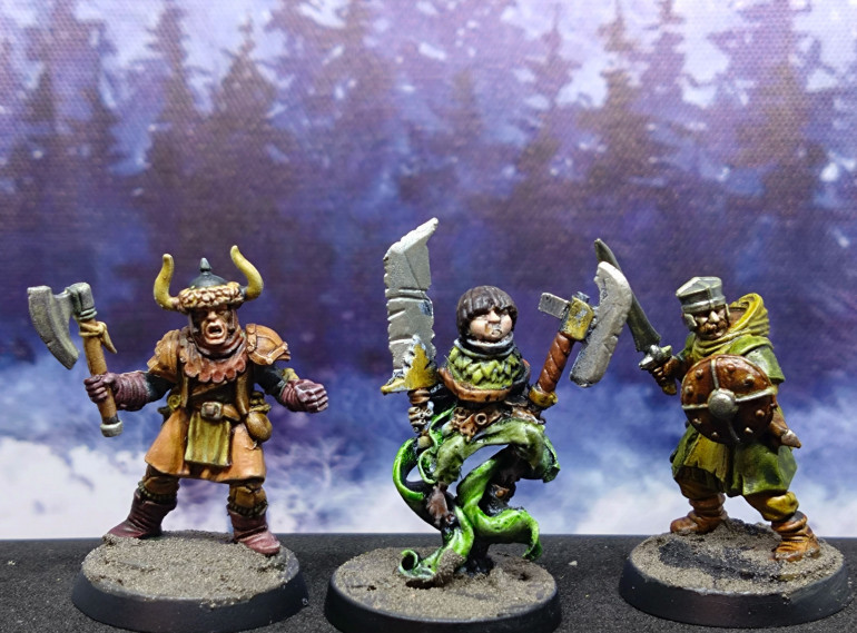 Two Frostgrave kitbashes flanking a Zenit miniatures orphan.