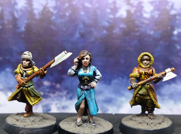 An Otherworld courtesan flanked by a couple of Frostgrave warrior women.