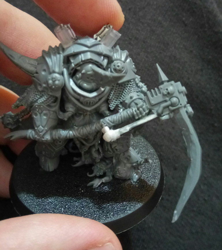 I had two Lord of Contagions because I had two Death Guard Dark Imperium sets to work with. So converting one to be a Typhus mini made sense to me. I didn't like the latest sculpt of the GW Typhus, so a conversion with a bit of sprue suited me fine. 