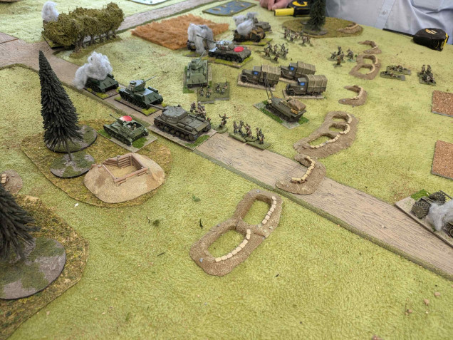 Once the Stugs are destroyed the Soviet armour starts to load infantry to try and achieve their objective.  But again the lead T34 and its tank riders are destroyed by the German third line of defence. 