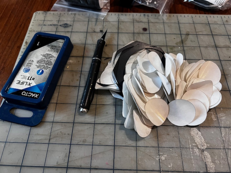 All the backing bits, used blades, and cut off magnet is quite the pile when said and done.