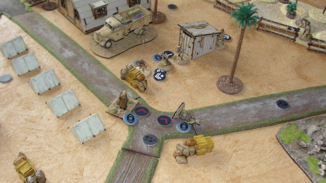 Near the supplies and truck all hell has been let loose as the other infantry patrol and the NCO have both been taken out and the Dog Handler suffering a near miss and again failing his “trauma” roll and will miss his next turn. In all the chaos “Broken Dice” has managed to place a demo charge in the truck and managed to move away before the explosion takes place (a valuable lesson he leant in a previous game). 