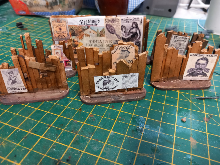 Using some spare mdf I made some fence like boarding and covered them in posters. So the table isn't all brick