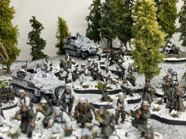 Armoured infantry ponders slowly forward clearing the woods in a dismounted fashion