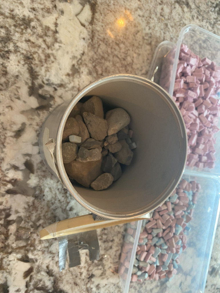 Just a can with some sharp rocks