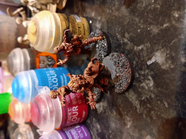 Then it was just base with Army Painter urban flock around the pathing puddle bases and prime. Used Halfords Red Primer and a light zenith spray of a flesh colour. Then I went back in with black and then a grey regular paint over the base.