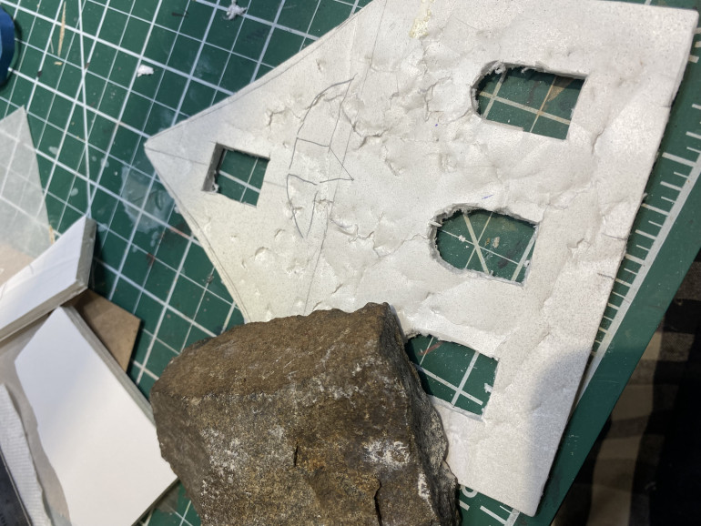 Just smashing a rock repeatedly against the foamcore for texture