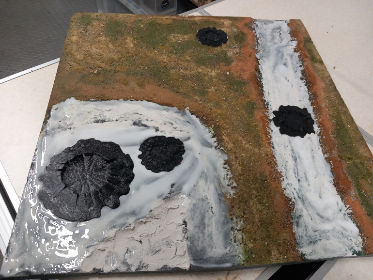 I 3d printed some craters ghat I printed in various sizes and removed any tufts from the board and used sand to fill in the stream znx make a gulley.