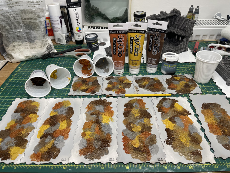 leopard spot blotches of orange, yellow, brown and grey being very uncareful about placement and blending... if it mixes all the better really!