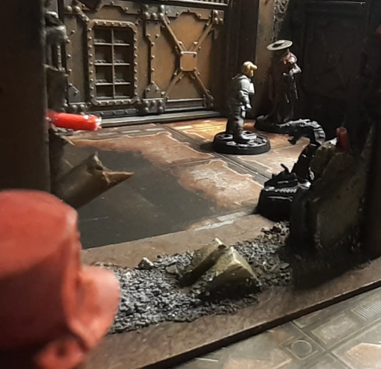 Twoflower watches from the shadows as a member of the Delaque House barters for some information from some hive scum.