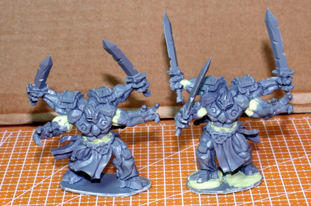 With the third pair, I reshuffled the body parts of both miniatures and resculpted the joints. 