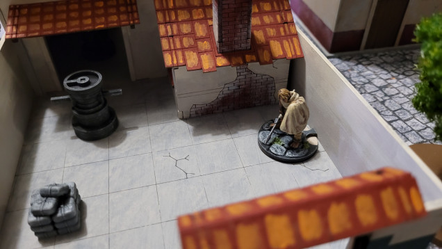 Antonia hides out behind the bakery to bind her wounds and plan her next move