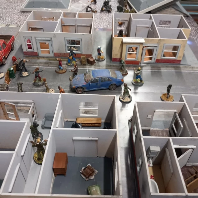 I recently 3D printed some furniture from Blacksite studios don't look back range which suits the walking Dead nicely. It allowed me to fill out my Woodburn buildings. There isn't mu g room to manoeuvre in the buildings so you don't want to over fill them