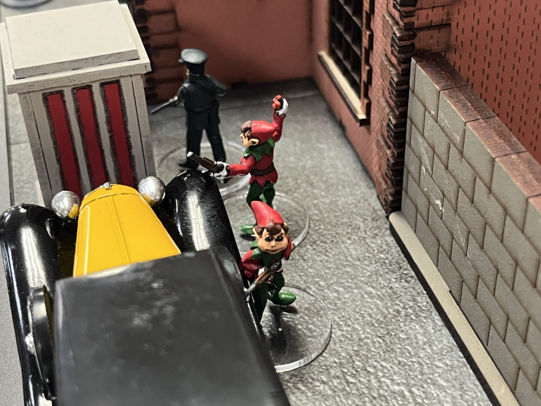 Cops and elves guard the front entrance to the precinct.  