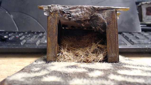 The Hay is made by buidling a mound of putty or something else, paint it black and glue cut up doormat bristles or something similar to give the impression of a hay pile.