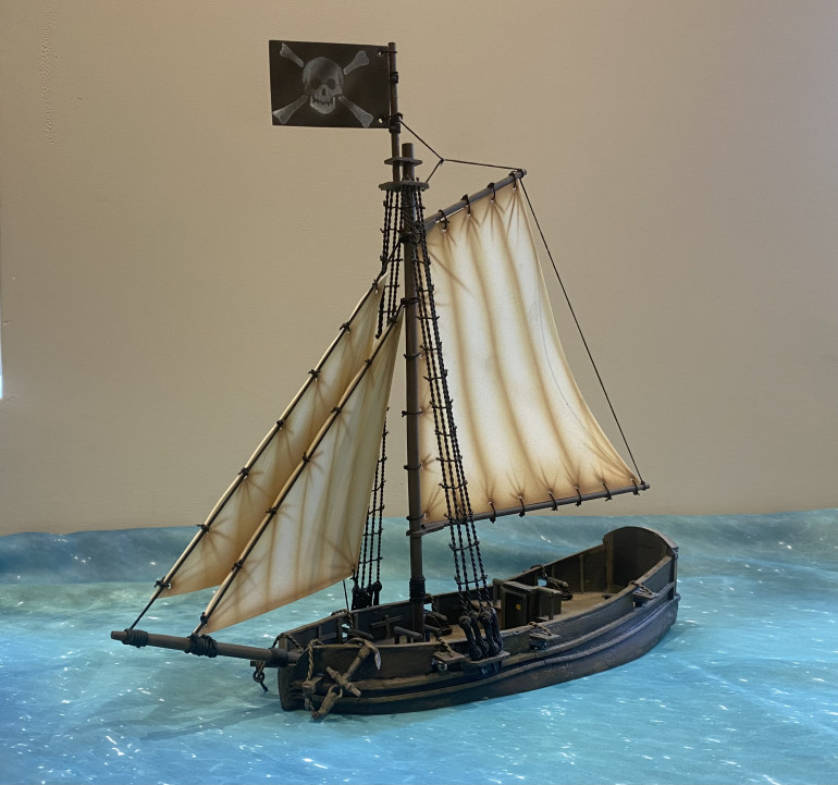 Currently my smallest built ship, a resin sloop from Ainsty Castings.  Armed with 6 small cannons.  The sloop is a probably one of the more common ships amongst Pirates due to its speed and excellent manoeuvrability. 