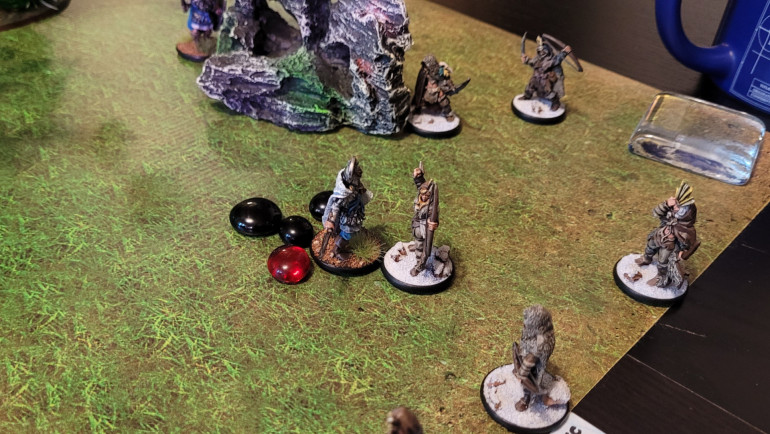 Sensing that I need to escalate matters, I run Kryxos into the middle of the fray -- if he can survive the combat phase I've got a Trick up my sleeve for the following round. Kryxos takes four hits which turn into three wounds, so hopefully it will be worth it...