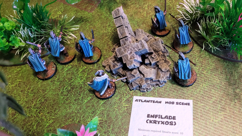 At the beginning of each turn (after initiative is rolled), each player has the option to play one of their six Tricks, once-per-game special abilities that provide the bulk of each faction's flavor. Luckily for me, I manage to successfully play Enfilade (it requires a 4+ roll on a d10), which allows me to reposition my forces anywhere on the board as long as it's at least 8 inches away from my opponent's models. Not only does this give me a huge head start, but it gets me away from the ravenous beasts.