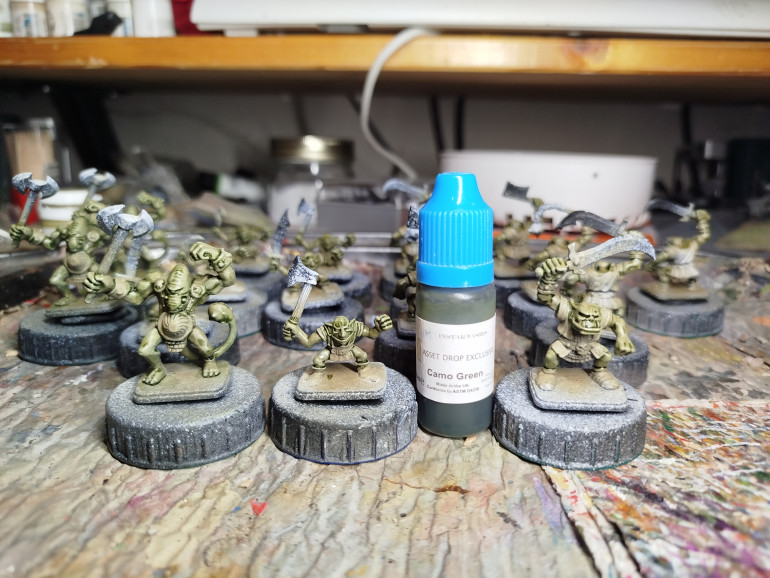 Finally, everything gets a wash with this pot of Instar Camo Green, which they made especially to go with these paints in an AssetDrop box that had a big orc in it.  It was never for sale and I don't know what I'm going to use when it runs out.  I like this scheme.