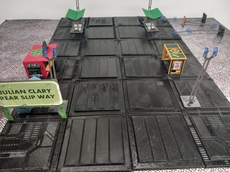 Im hoping to do a 4 by 3 table with a road down the middle. I've put some bits of scenery I already have down to see how it's looking.