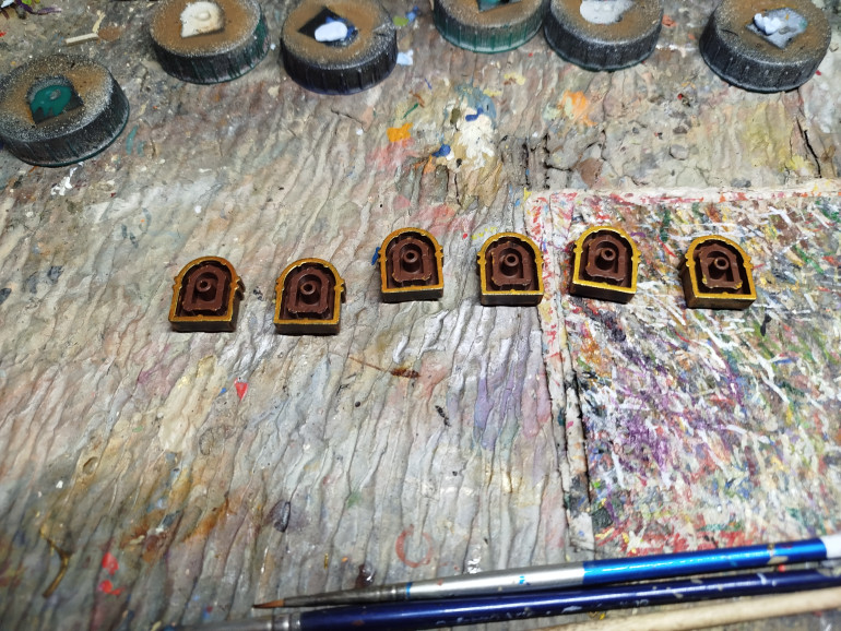 Once everything is varnished and the varnish has had plenty of time to set, you can paint the other sides of the chest ends.  I did not paint the previously inaccessible parts of the other furniture as they should be out of line of site.  Don't forget to varnish these bits too when you're done