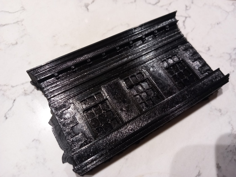 I found a multipart victorian house/shop free on thingiverse. It doesn't clip together too well so i trimmed and glued it
