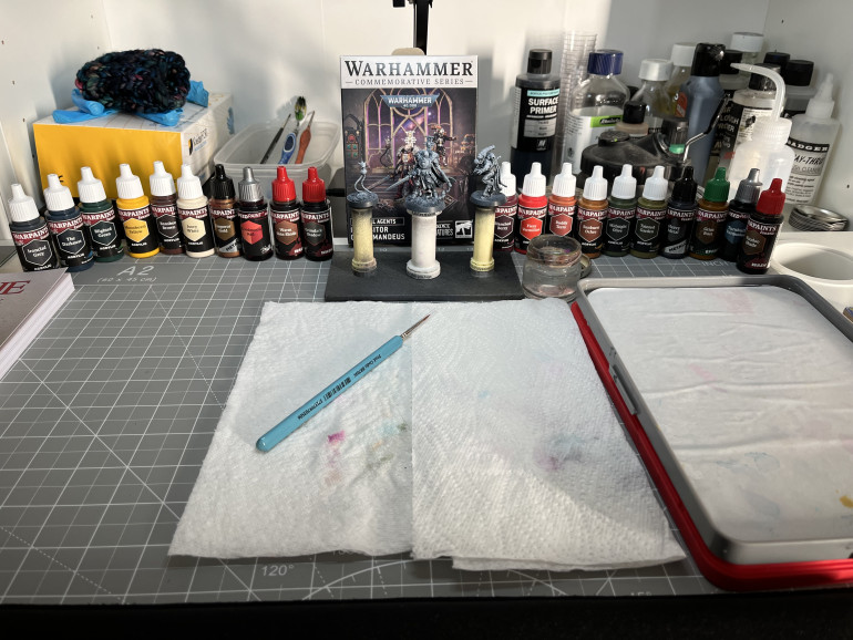 Set up and ready to go! Volume 1 paints on the left, volume 2 on the right.  I am even going to try the little synthetic brush that came with the sets.