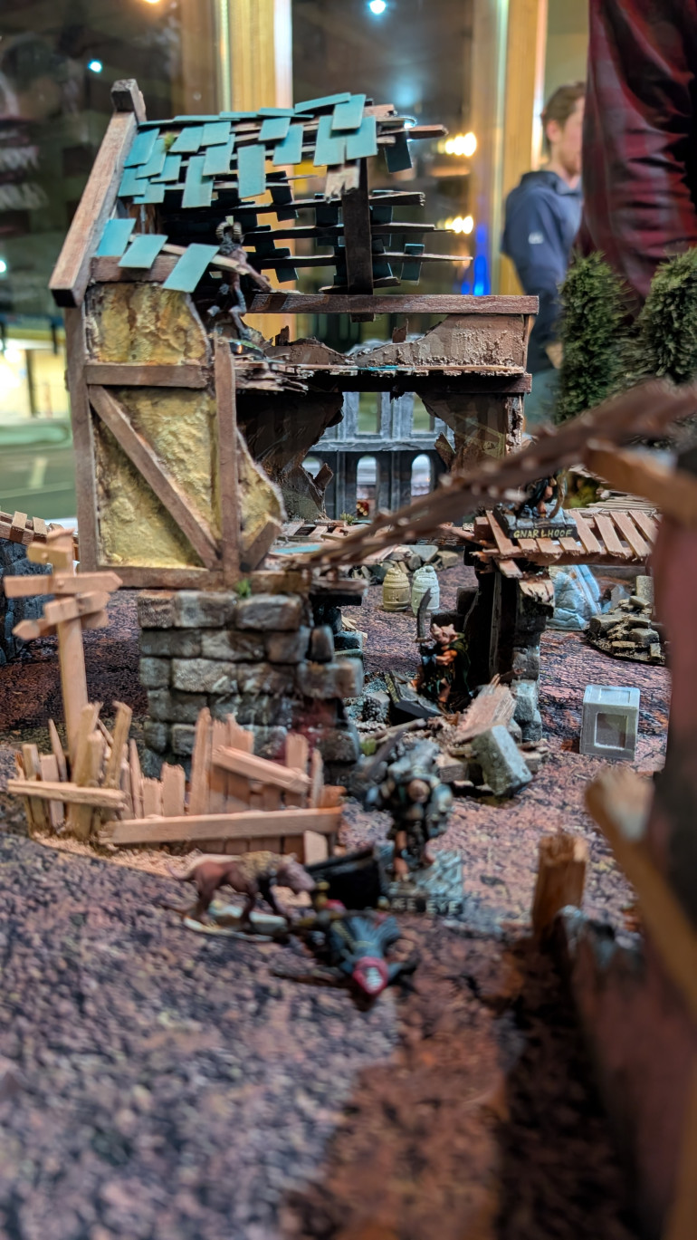 Stunned archer in the foreground, Beastman in the rafters in the background.