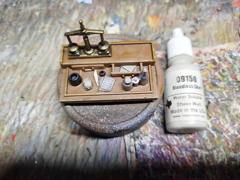 Base coat the feather.  I hate painting feathers.