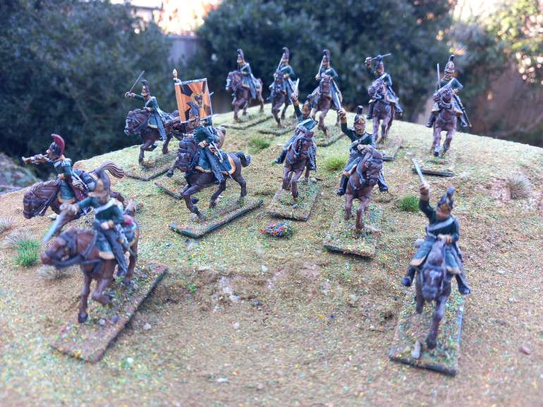 Shakos and bayonets allows you to field a unit of Dragoons with between 6 and 12 troopers. The perry box set easily covers this with the edition of an officer.