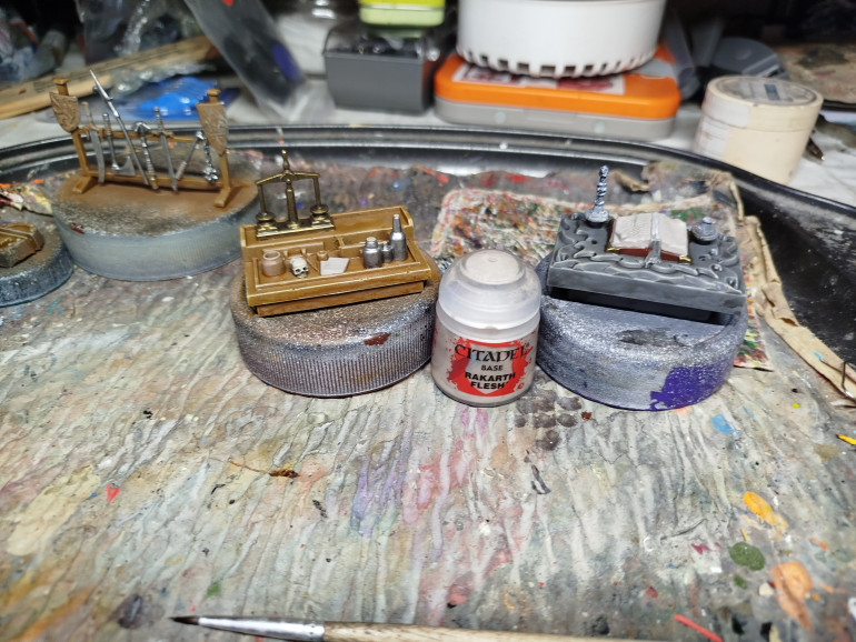 Base coat the paper of the book, and on the desk.  Don't forget inside the drawer!